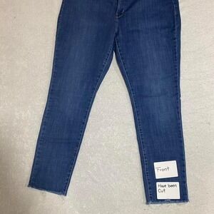 Levi's blue denim jeans 311 shapping skinny women 34 with frayed hem. SKU546